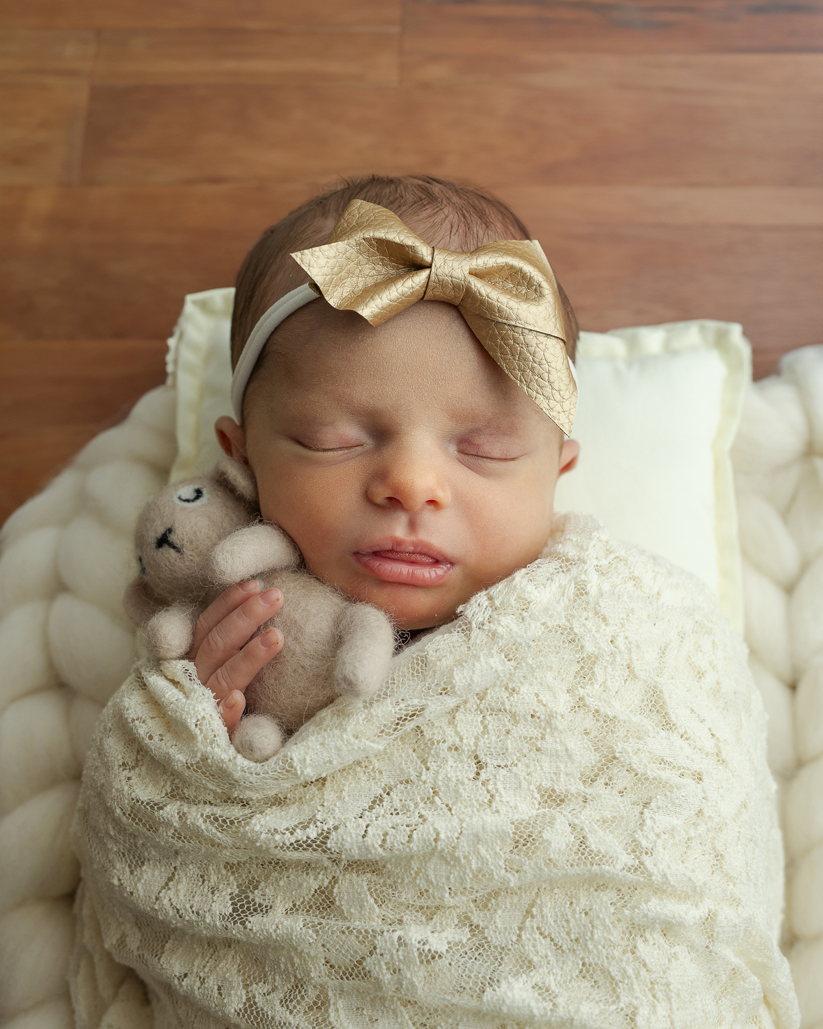 Baby Jordan holding a tiny stuffy