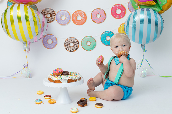 toddler eating donuts