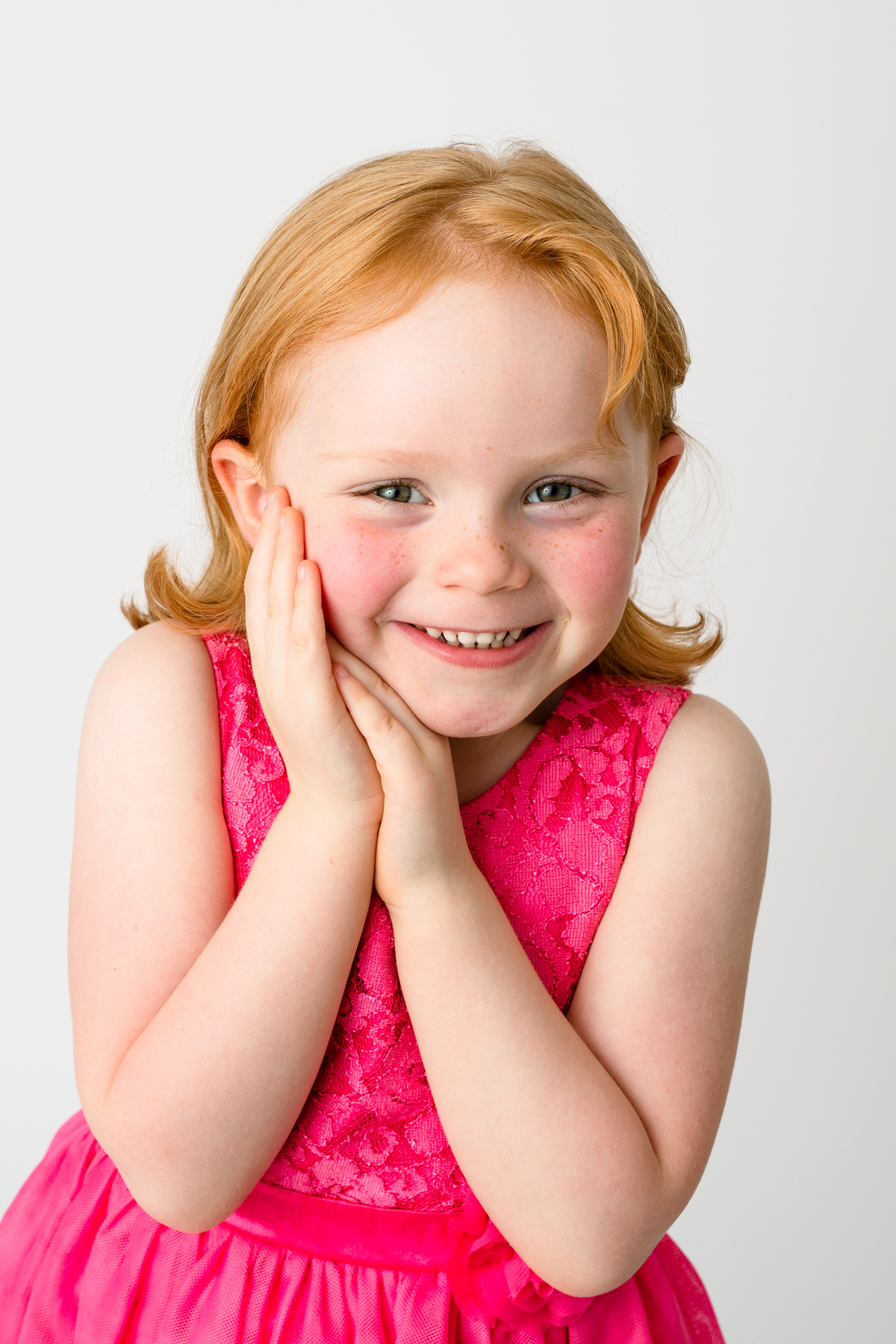 Red-Headed child in a pink dress