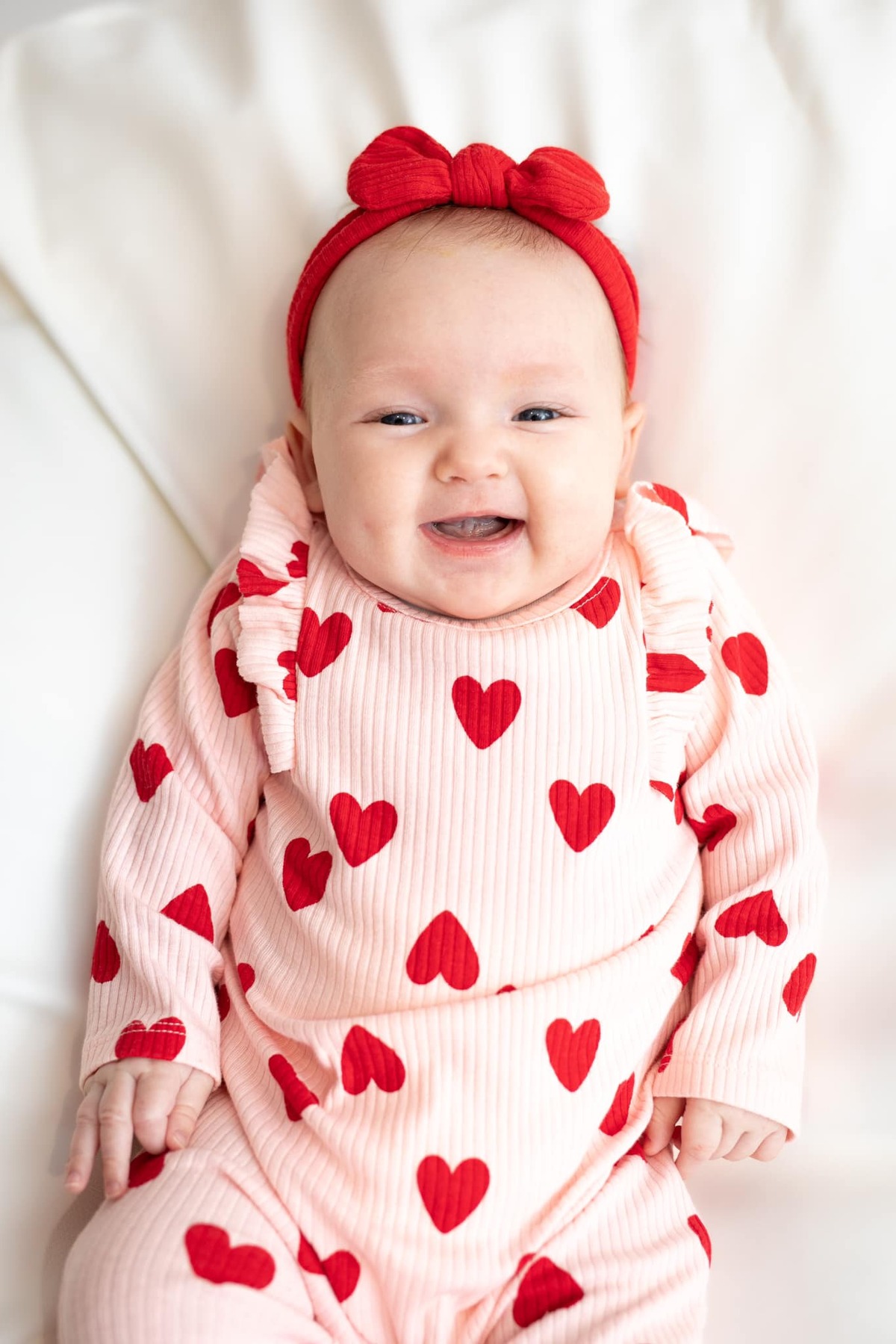 baby in valentine hearts outfit